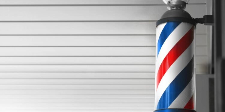 O que significa aquele poste giratório colorido das barbearias